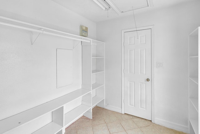 walk in closet featuring light tile patterned floors