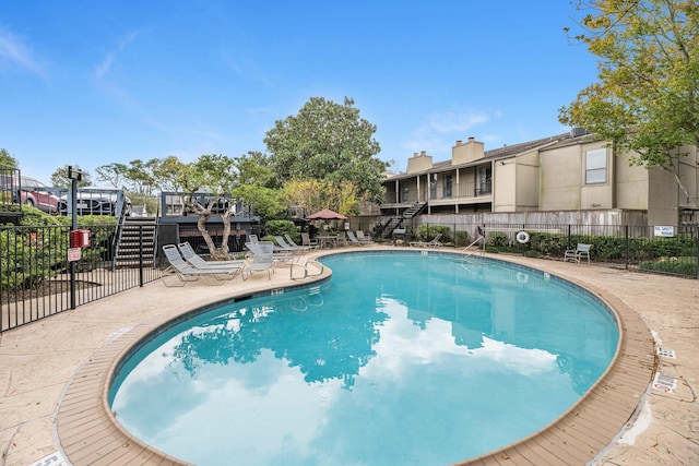 view of pool featuring a patio