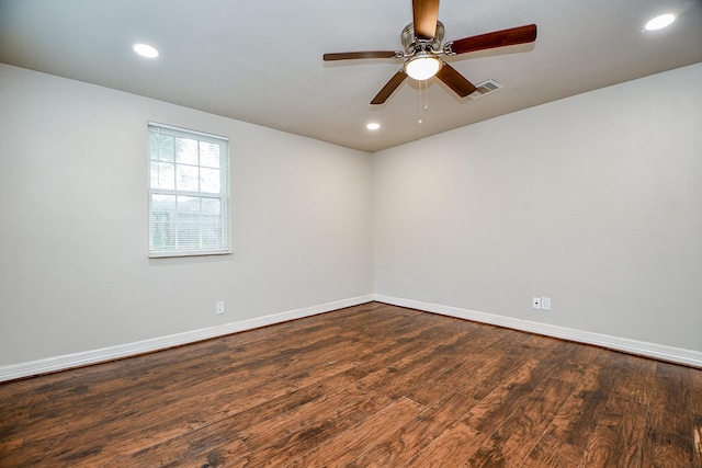 spare room featuring hardwood / wood-style flooring and ceiling fan