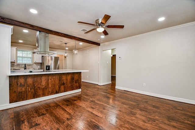 kitchen with dark hardwood / wood-style floors, stainless steel refrigerator with ice dispenser, island exhaust hood, kitchen peninsula, and white cabinets