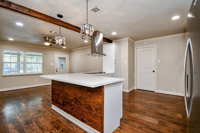 kitchen featuring island exhaust hood, stainless steel fridge, ceiling fan with notable chandelier, dark hardwood / wood-style floors, and hanging light fixtures