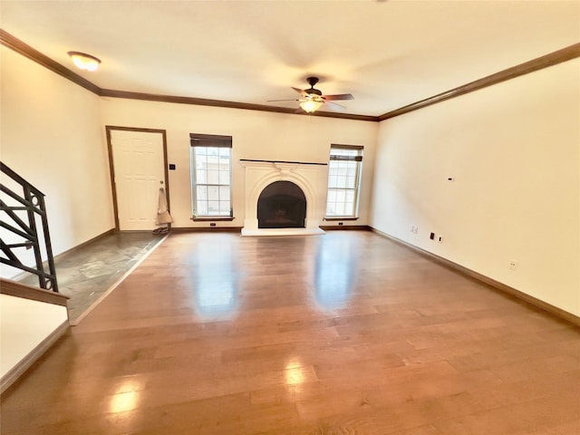 unfurnished living room featuring ceiling fan, hardwood / wood-style floors, a healthy amount of sunlight, and ornamental molding