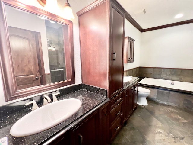 bathroom with vanity, toilet, ornamental molding, and a washtub