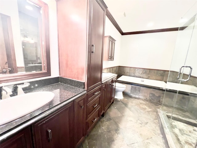 full bathroom featuring independent shower and bath, vanity, toilet, and crown molding