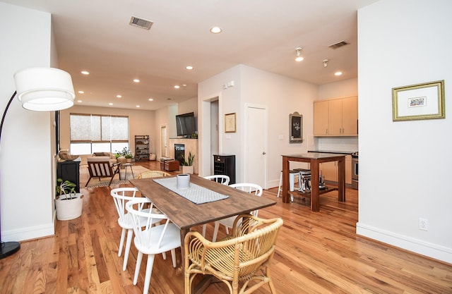 dining space featuring light hardwood / wood-style floors