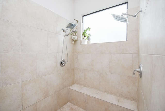 bathroom with a tile shower