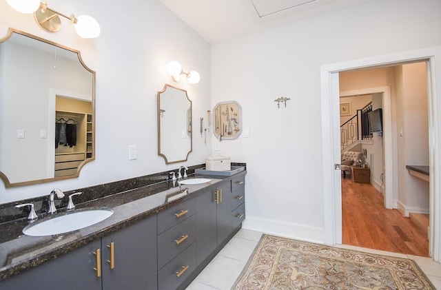 bathroom featuring tile patterned flooring and vanity