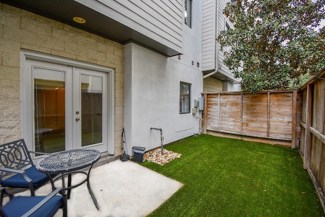 view of yard with a patio area and french doors