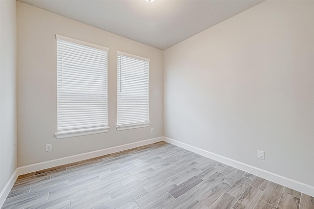 spare room featuring light hardwood / wood-style flooring