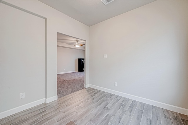 spare room with ceiling fan