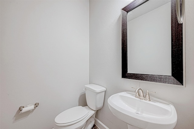 bathroom with toilet and sink