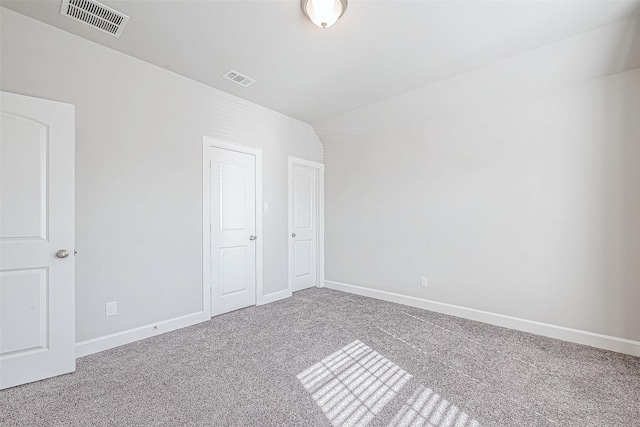 unfurnished bedroom featuring carpet flooring and a closet