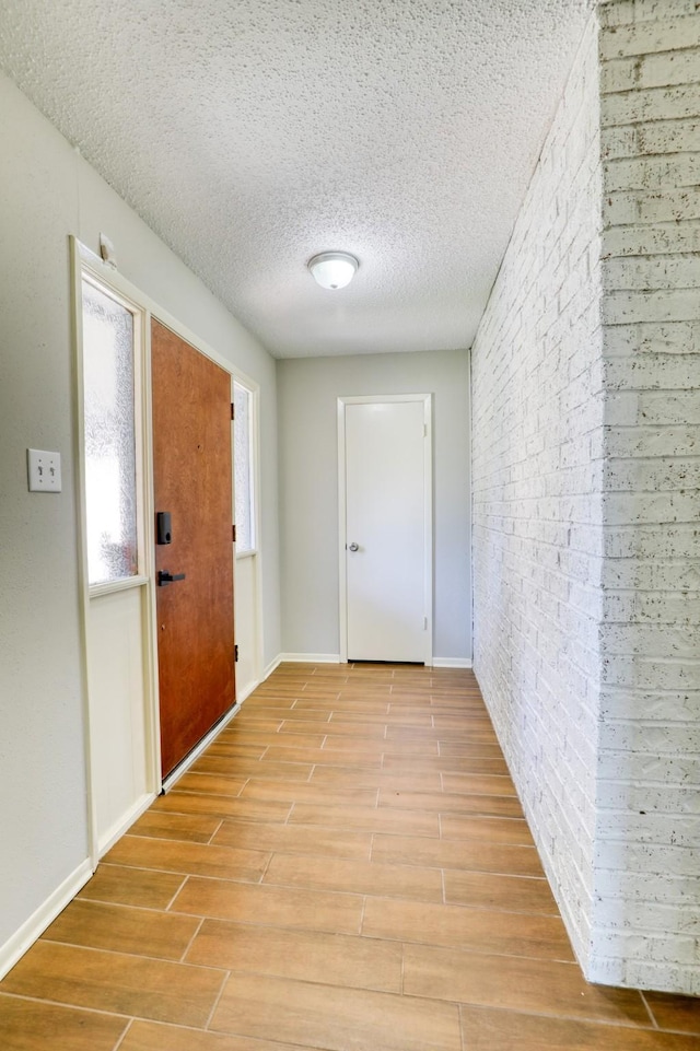 interior space with a textured ceiling