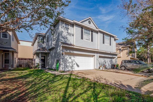 view of front of home featuring a garage and a front lawn