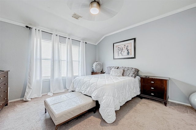 bedroom with light colored carpet, crown molding, ceiling fan, and lofted ceiling