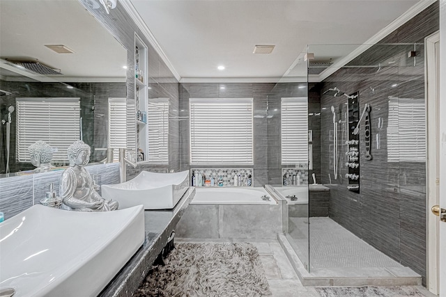 bathroom with vanity, separate shower and tub, and crown molding