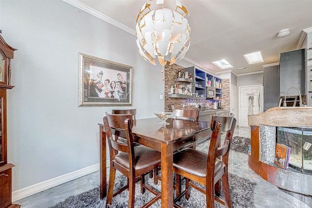 dining area with ornamental molding, sink, and a chandelier