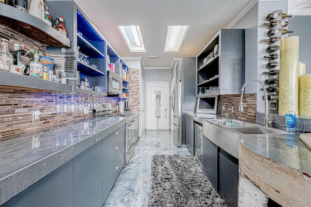 kitchen with decorative backsplash, stainless steel appliances, ornamental molding, and sink