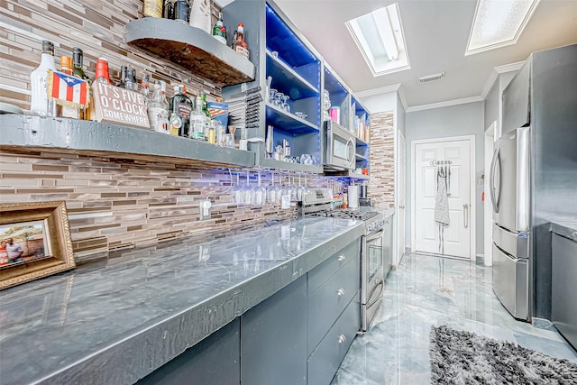 kitchen with decorative backsplash, crown molding, and appliances with stainless steel finishes