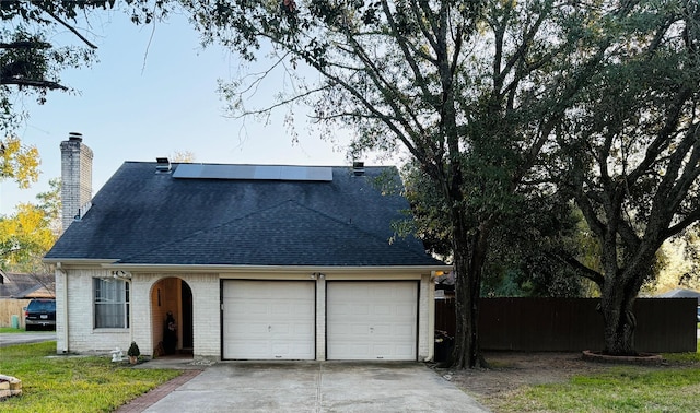 view of front of property with solar panels