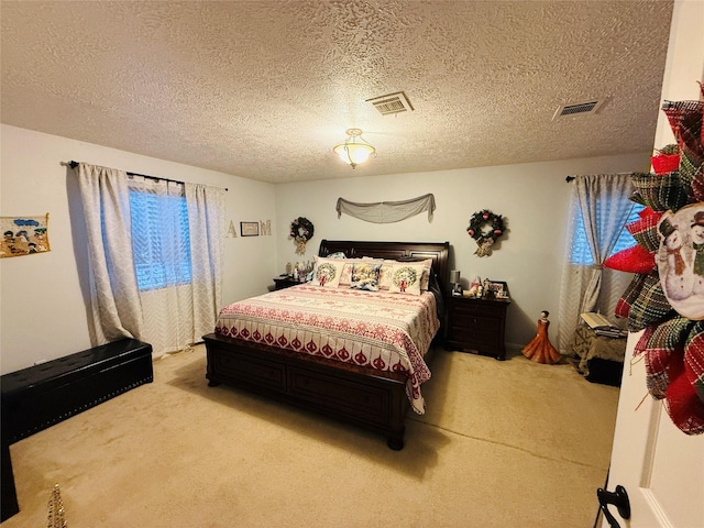 carpeted bedroom featuring a textured ceiling