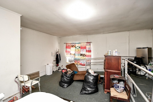 interior space featuring stainless steel fridge and baseboard heating