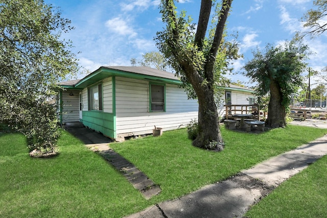 view of property exterior featuring a yard