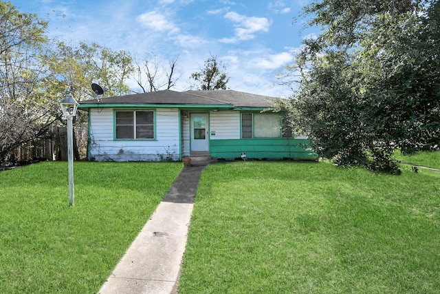 ranch-style house with a front yard