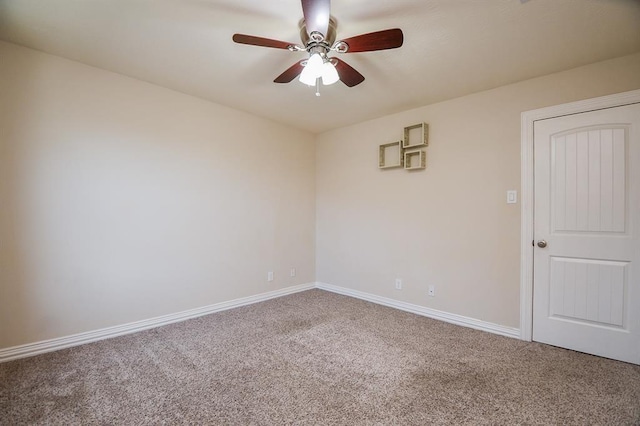 empty room featuring carpet and ceiling fan