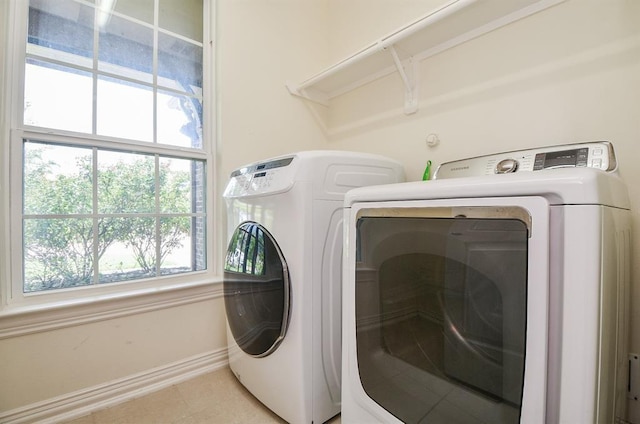 washroom with independent washer and dryer