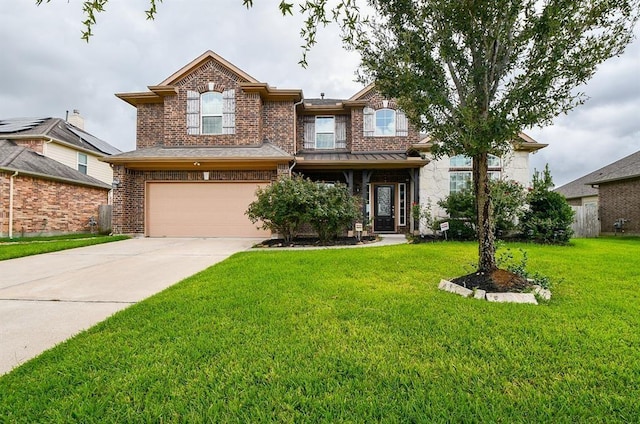 view of front of house featuring a garage and a front lawn