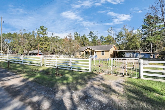 exterior space featuring a rural view and a carport