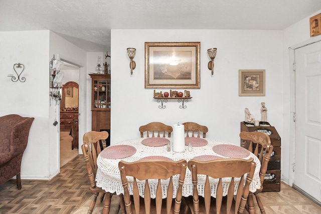 dining room with parquet flooring