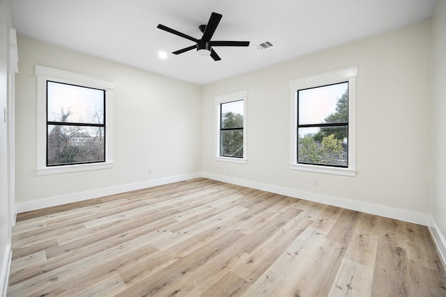 unfurnished room featuring ceiling fan and light wood-type flooring