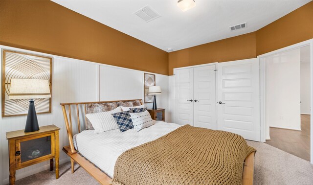 bedroom featuring light carpet