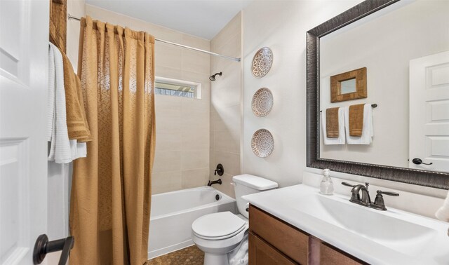 full bathroom with shower / tub combo, vanity, and toilet