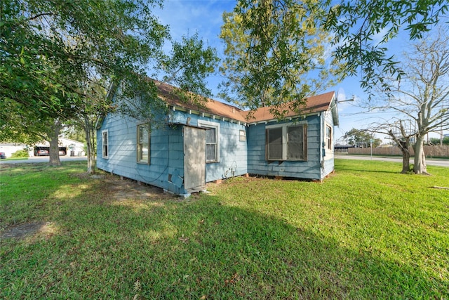 view of property exterior featuring a yard