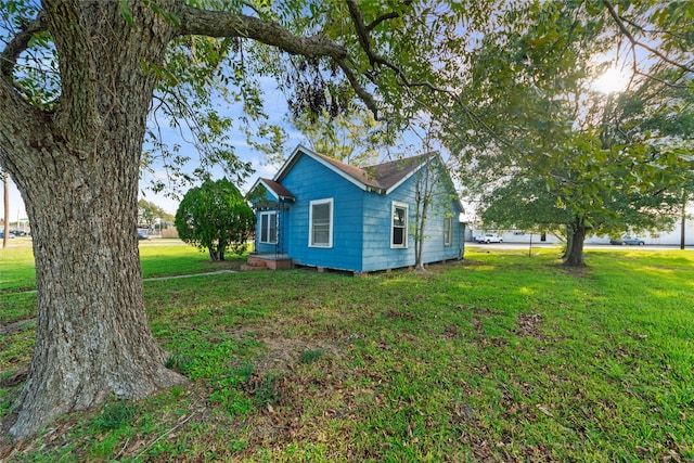 view of property exterior featuring a yard