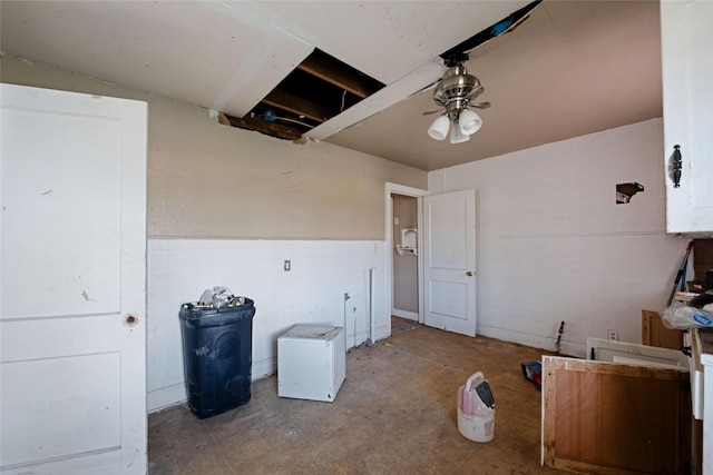 interior space featuring ceiling fan