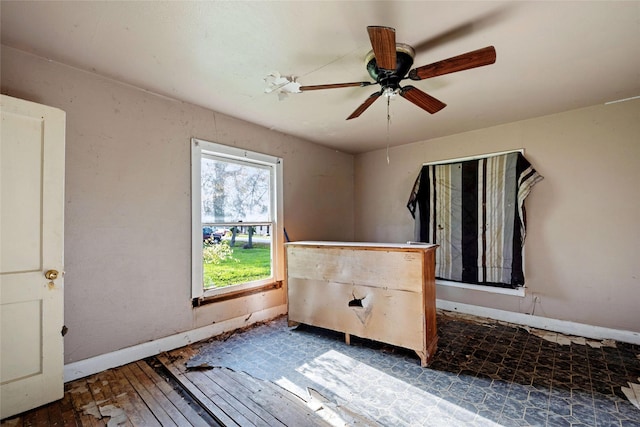 spare room with wood-type flooring and ceiling fan