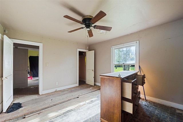 home office featuring hardwood / wood-style flooring and ceiling fan