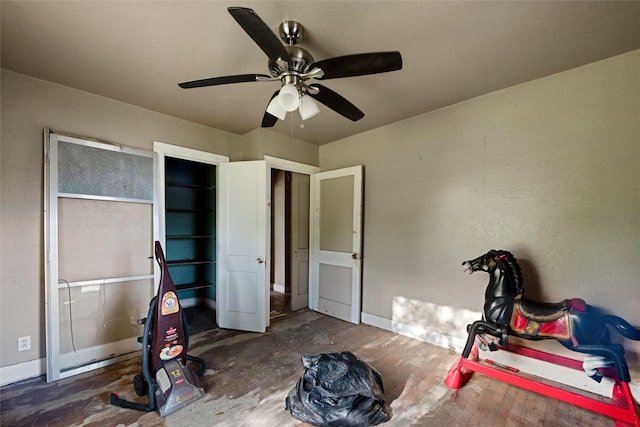 bedroom with ceiling fan and dark hardwood / wood-style flooring