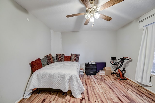 bedroom featuring ceiling fan and light hardwood / wood-style flooring