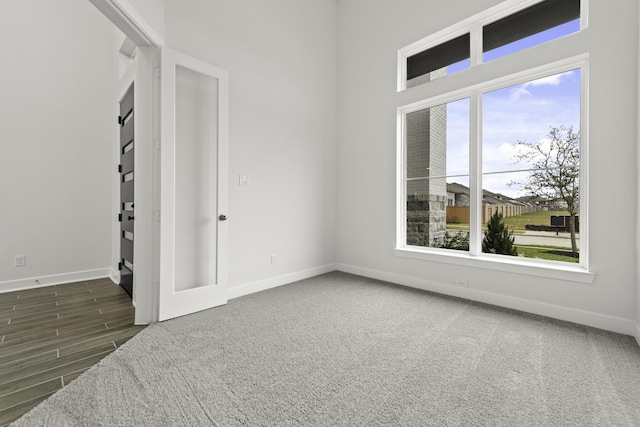 spare room featuring dark hardwood / wood-style floors