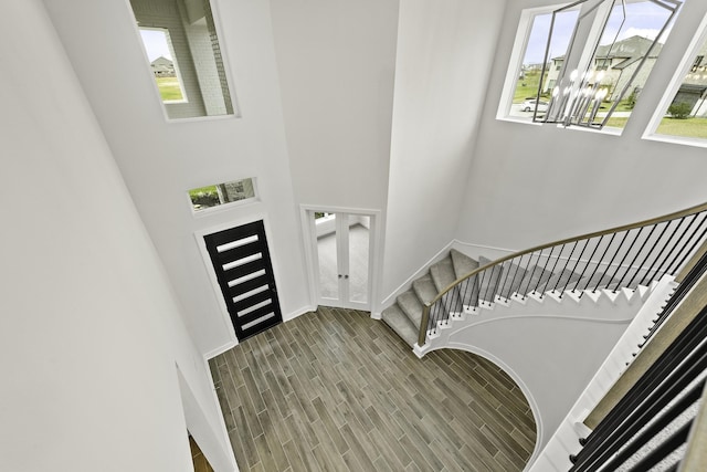 entryway with plenty of natural light, wood-type flooring, and french doors