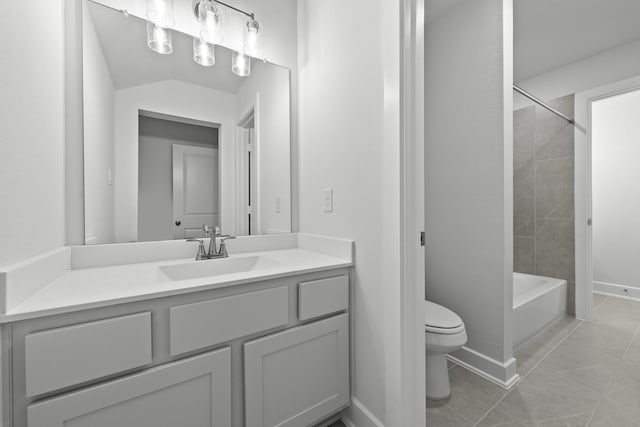 full bathroom with tiled shower / bath combo, tile patterned floors, lofted ceiling, toilet, and vanity