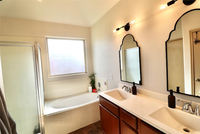 bathroom featuring vanity, wood-type flooring, lofted ceiling, and shower with separate bathtub