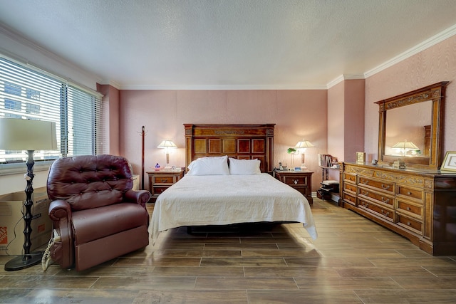 bedroom with crown molding and a textured ceiling