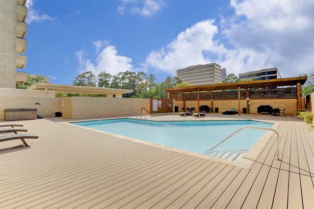 view of pool featuring a deck and a patio area