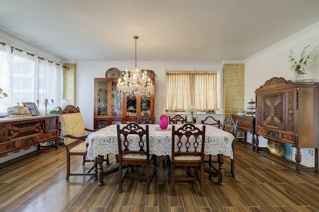 dining area featuring ornamental molding and an inviting chandelier